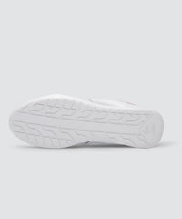 Bottom view of white AKIN driving shoe for car enthusiasts. 